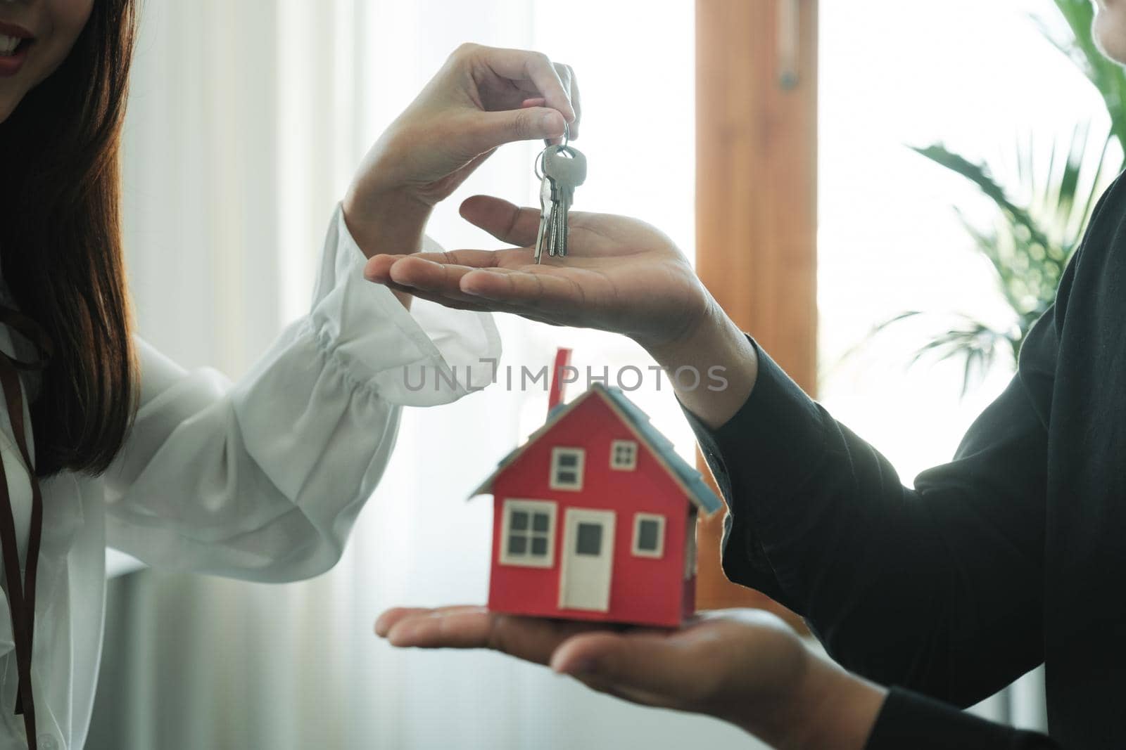 Businessman Holding House Keys. by ijeab