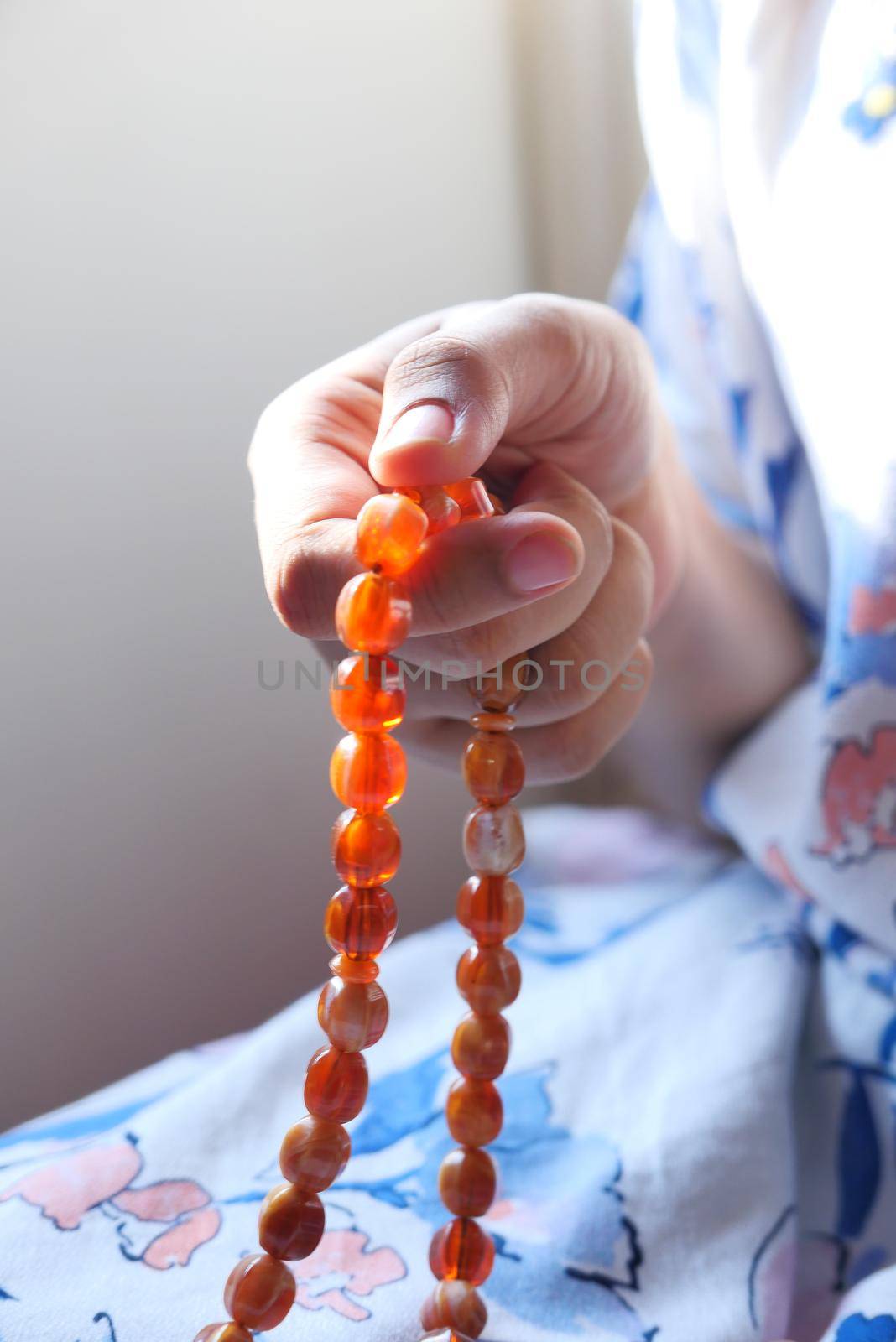 Close up of muslim women hand praying at ramadan .