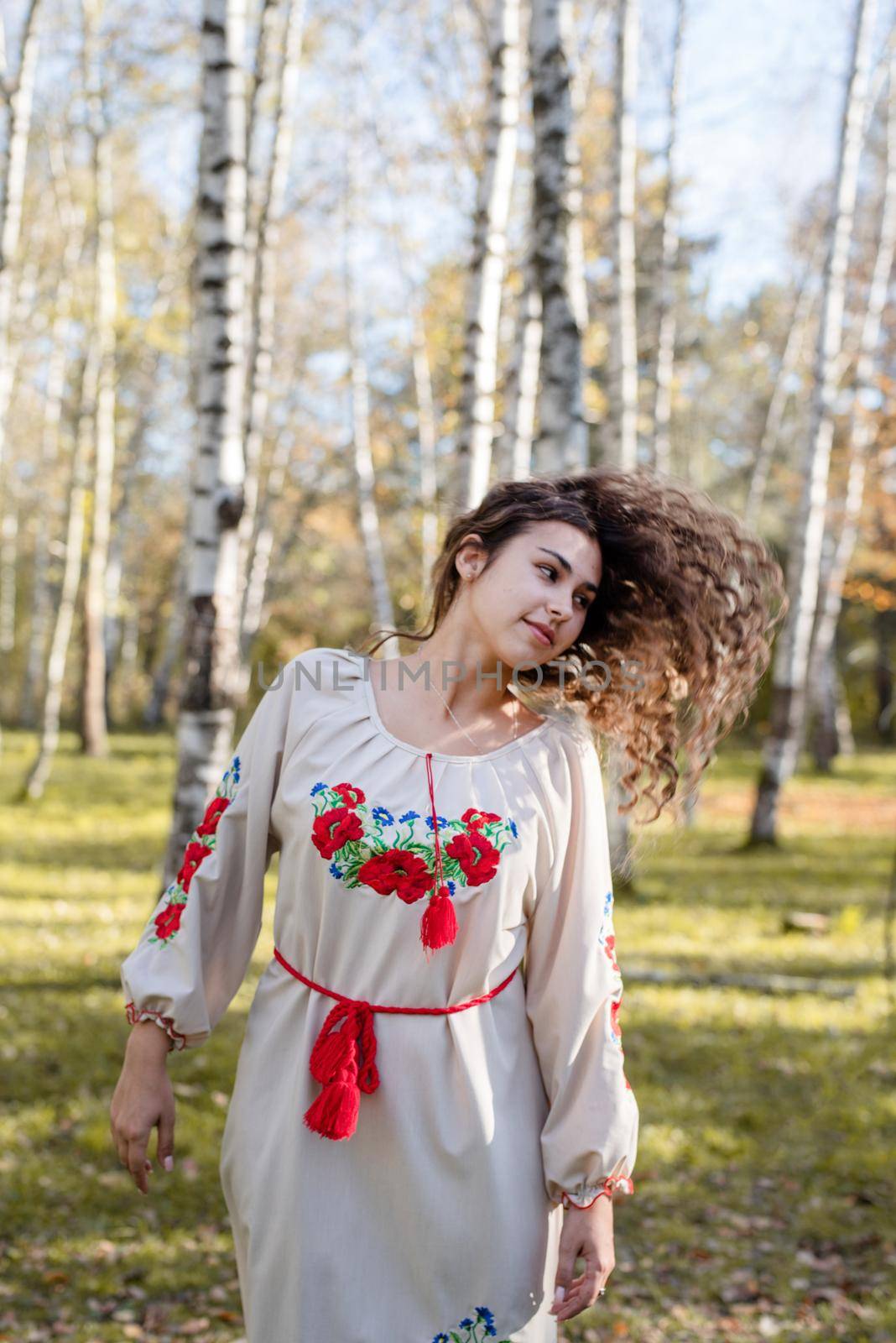 Indigenous people. beautiful woman in national ukrainian national traditional costume clothes dancing in forest
