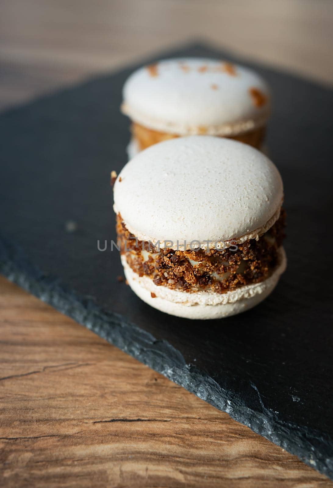 A delicious pasta dessert - a French sweet treat lies on a concrete black stand, close-up