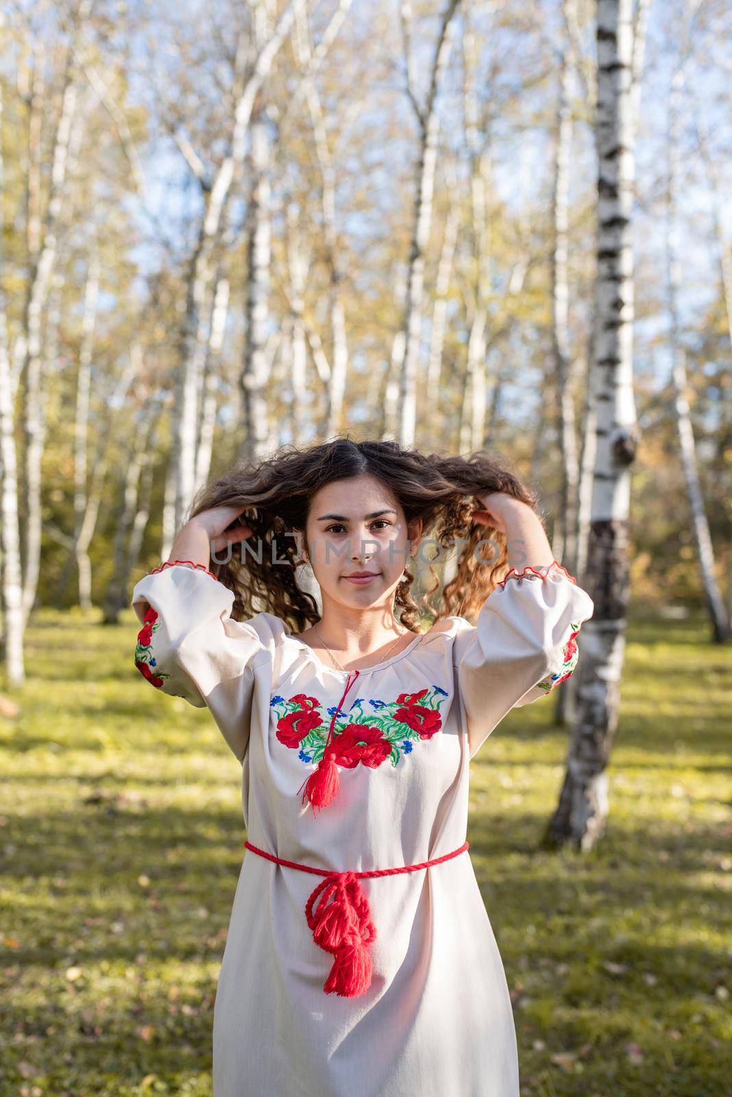 Indigenous people. beautiful woman in national ukrainian national traditional costume clothes walking in forest