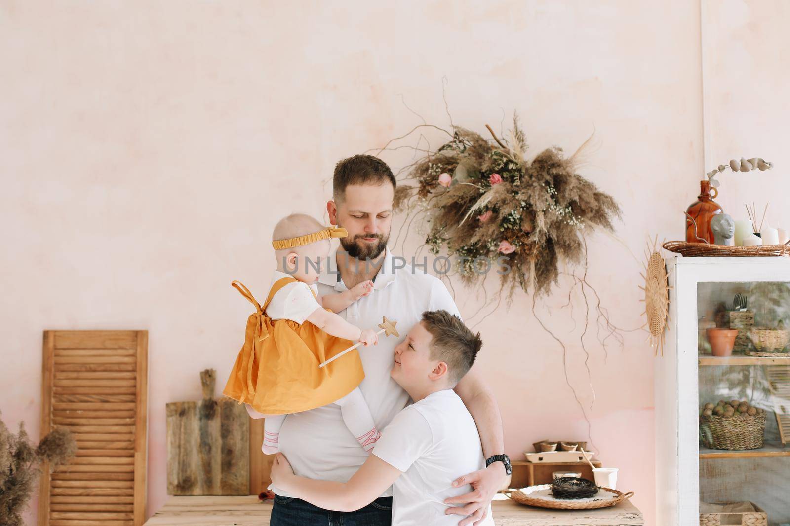 Father with his son and daughter at home. Happy family having fun together. Happy Father's Day by paralisart