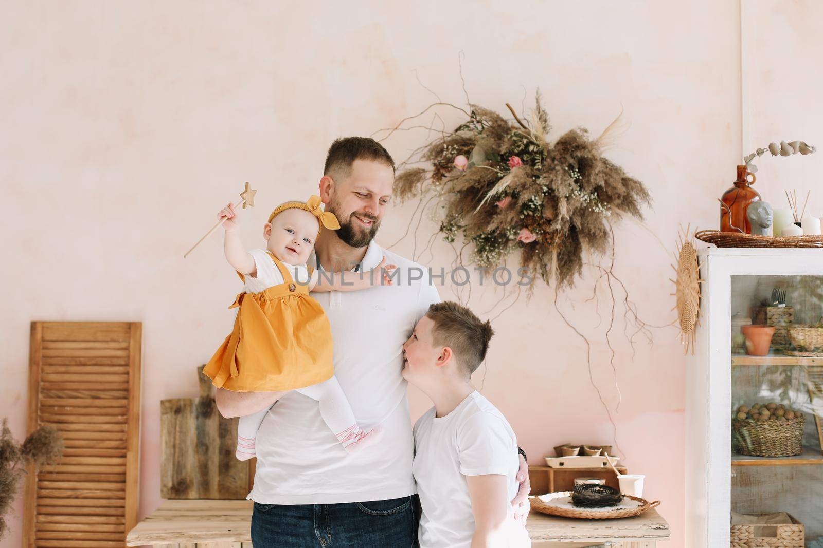 Father with his son and daughter at home. Happy family having fun together. Happy Father's Day by paralisart