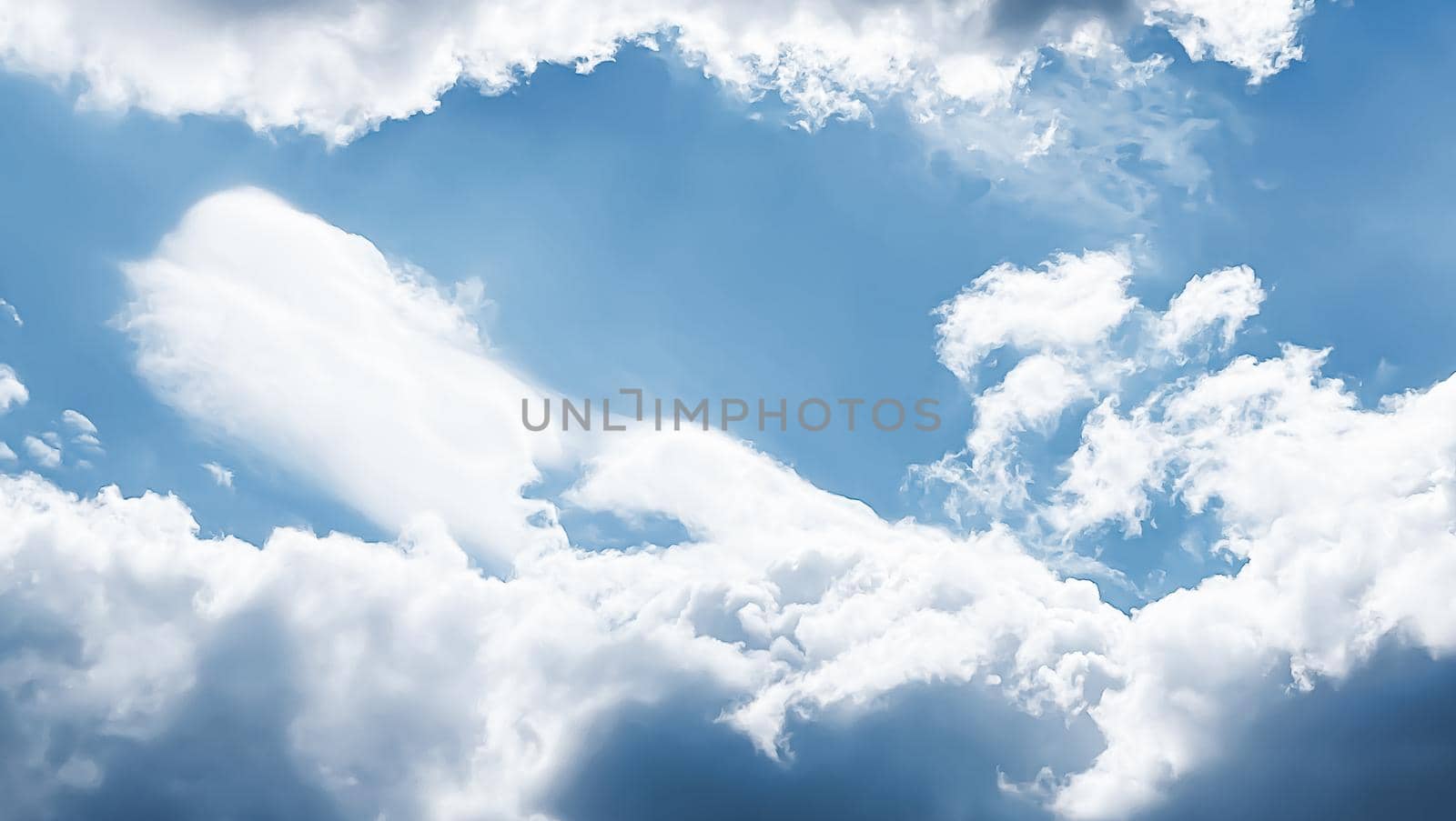 Sunny blue cloudy sky as abstract background, beauty in nature design by Anneleven