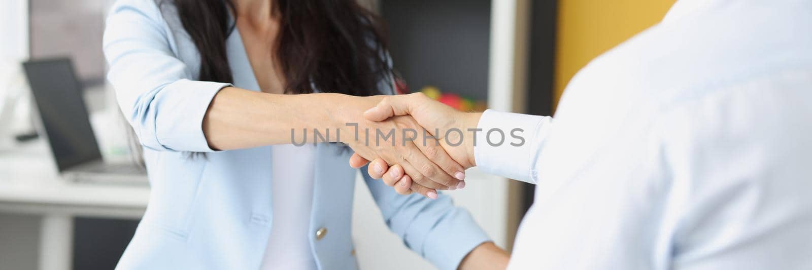 Portrait of female hr manager handshake hire male candidate at job interview, good first impression. People shaking hands after meeting, successful agreement. Business, respect concept