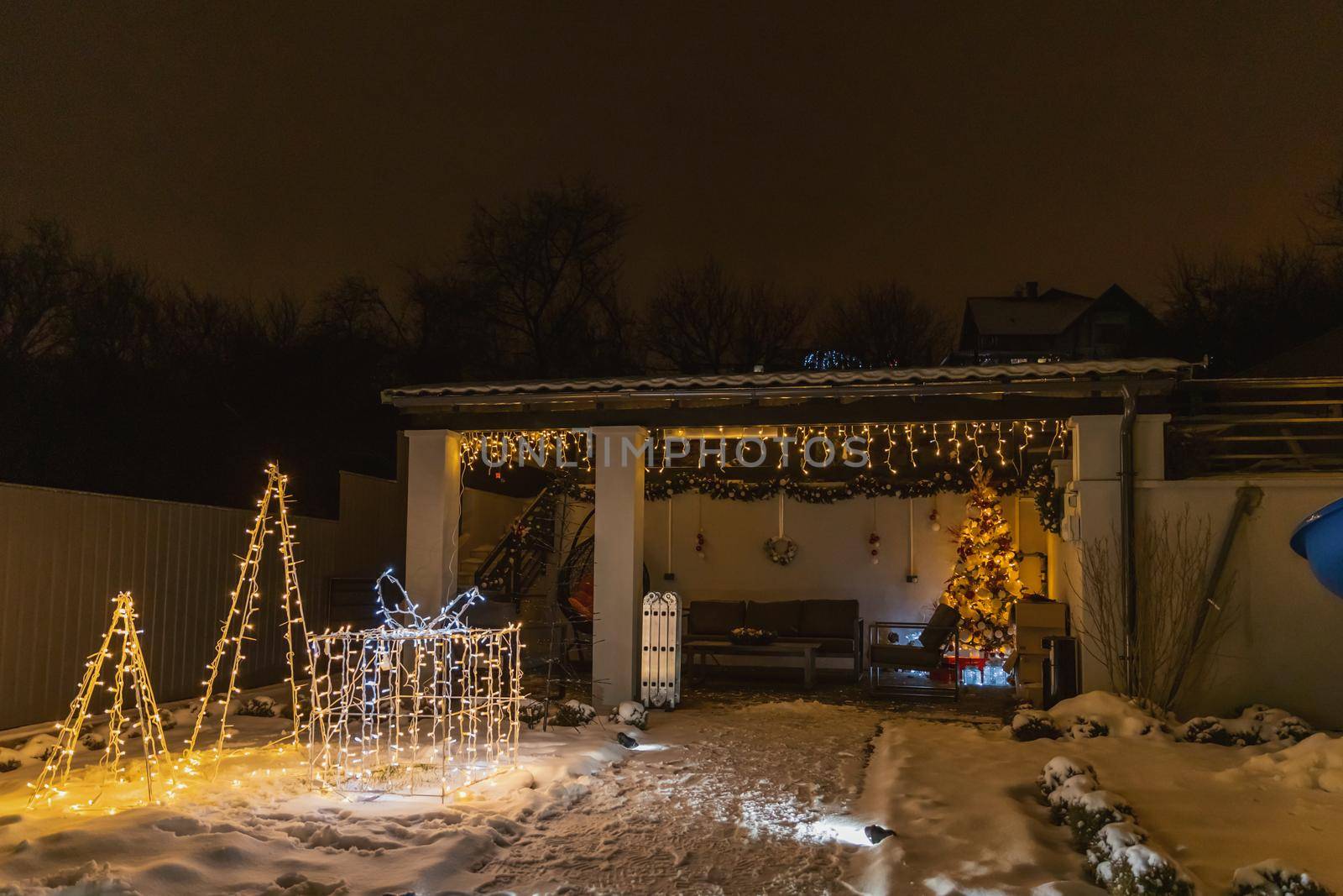 courtyard decorated with glowing garlands by zokov