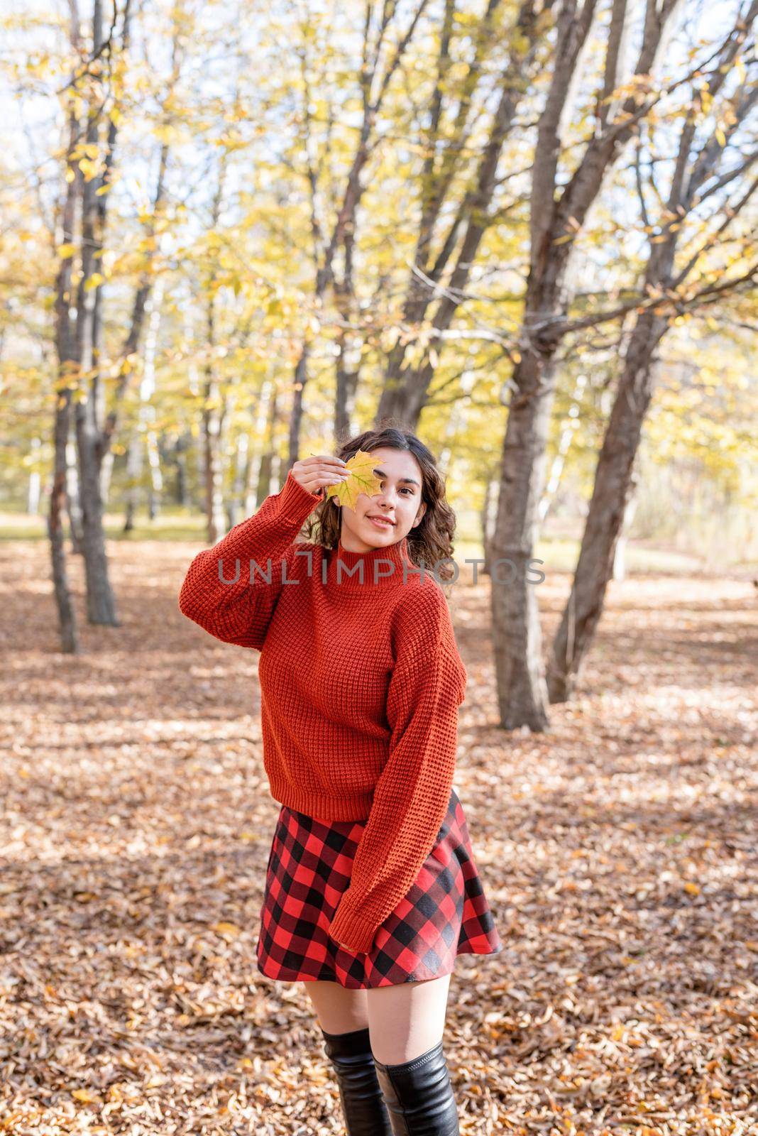 young happy woman walking in autumn forest by Desperada