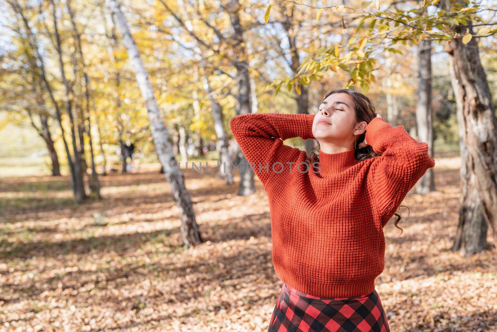 young happy woman walking in autumn forest by Desperada