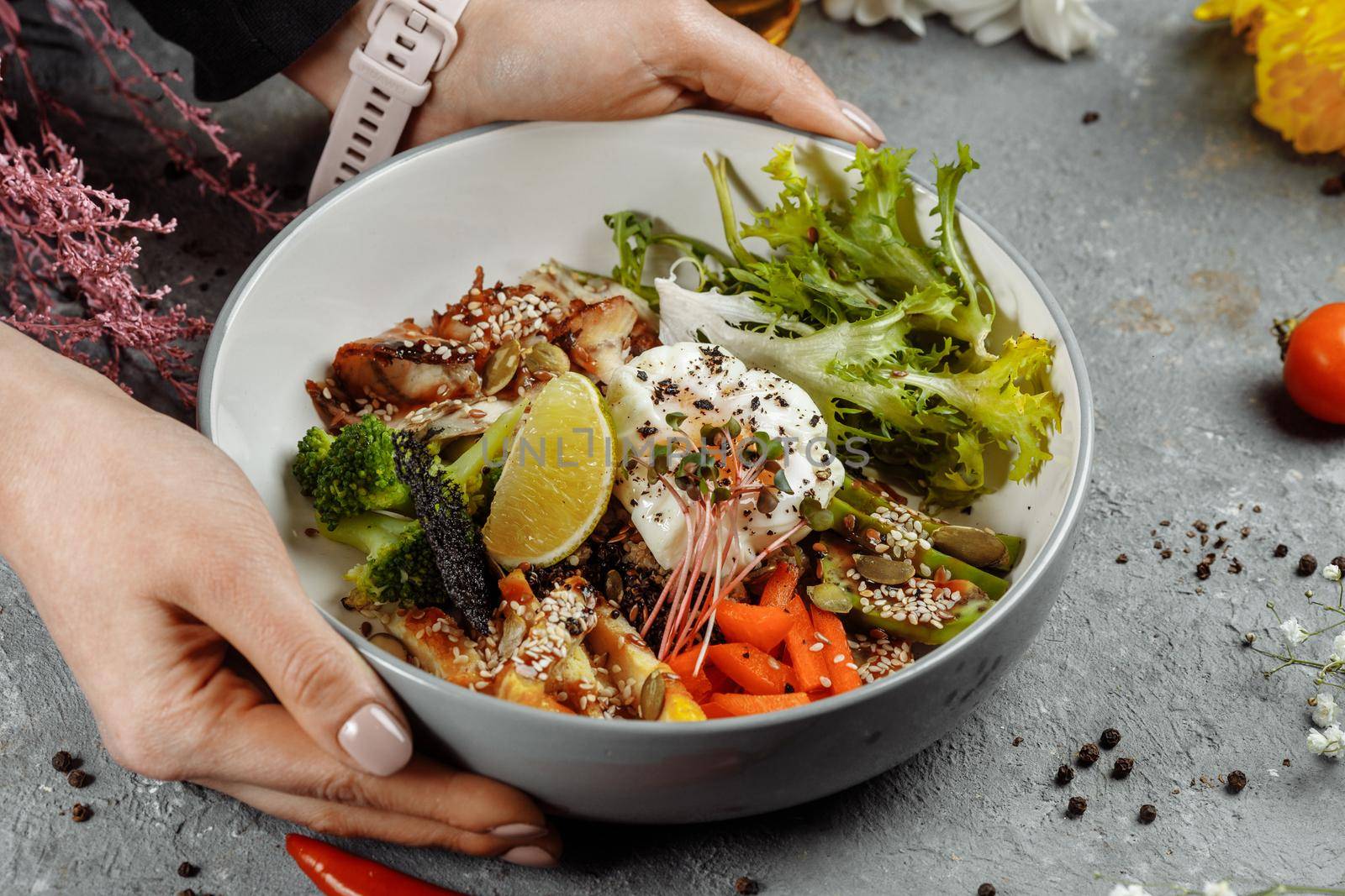 Healthy bowl - quinoa salad with tuna, broccoli, avocado on wooden rustic table. top view.