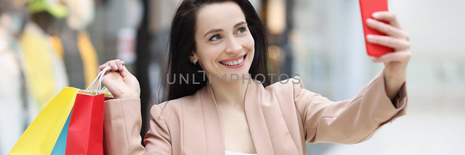 Cute cheerful woman making photo by kuprevich