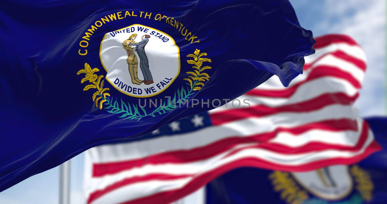 The Kentucky state flag waving along with the national flag of the United States of America by rarrarorro