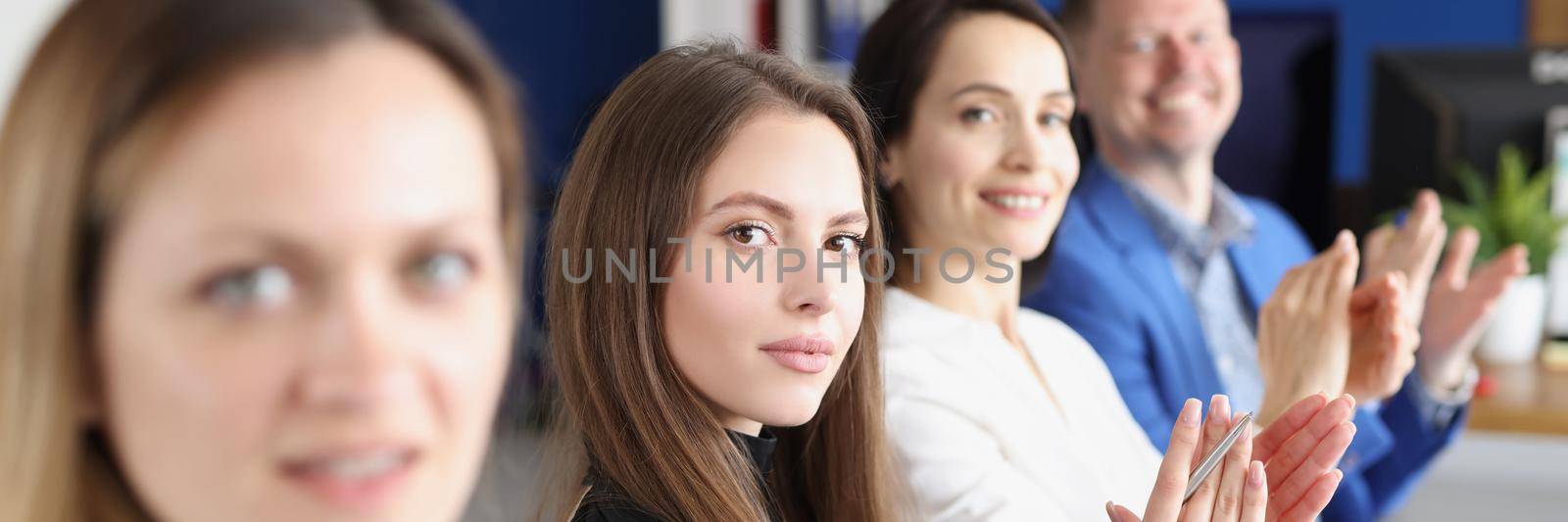 Portrait of business people clapping and applause at meeting or conference, group of colleagues in modern company office. Success teamwork or corporate coaching, business concept