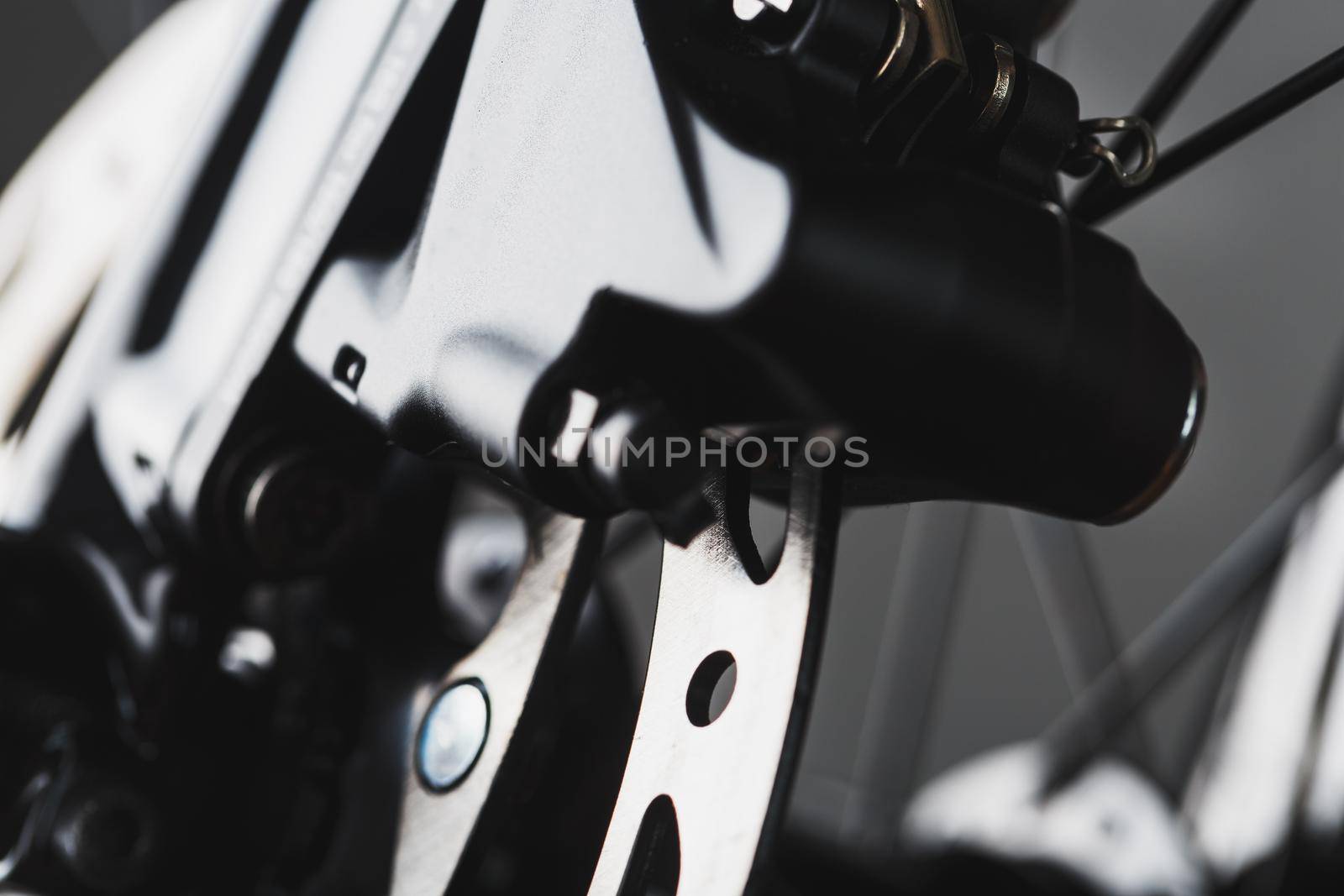 Shiny bicycle brake rotor close-up in macro with selective focus by AlexGrec