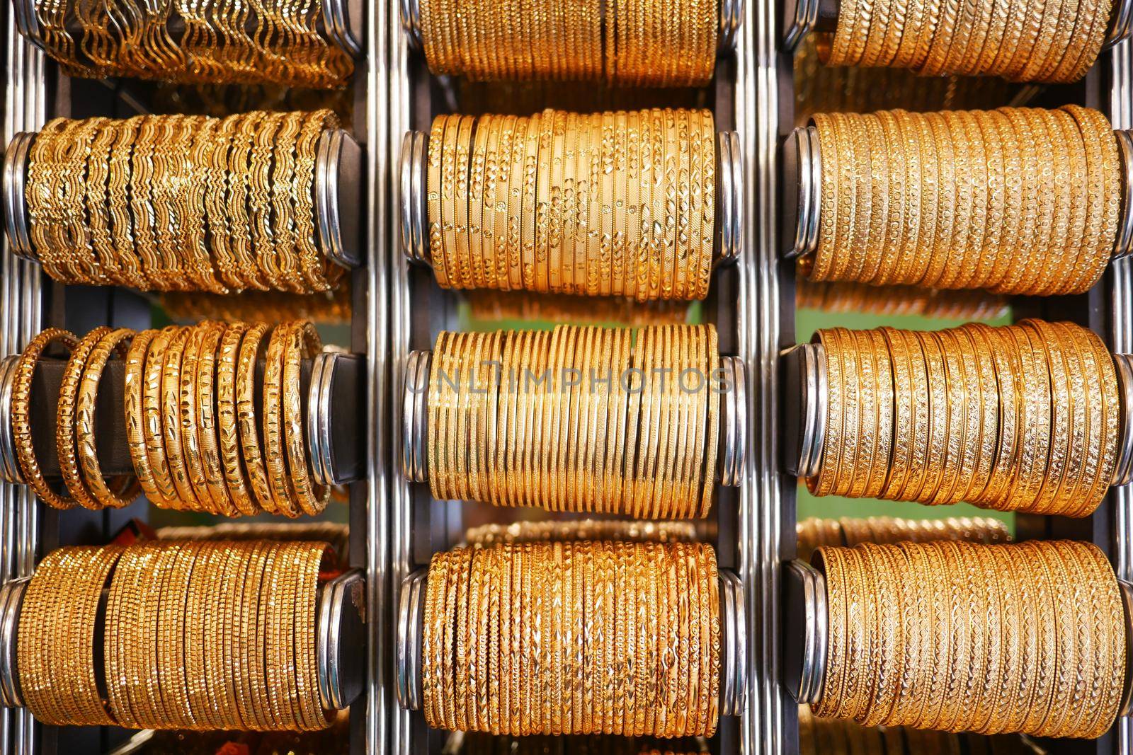 golden color bangles display for sale at local store