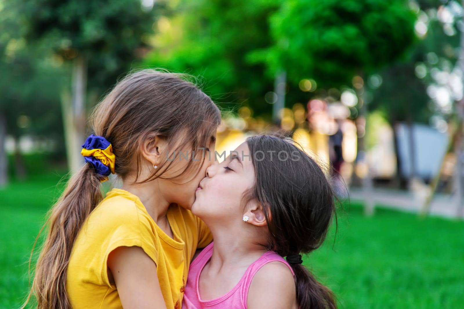 The child examines the snails on the tree. Selective focus. by mila1784