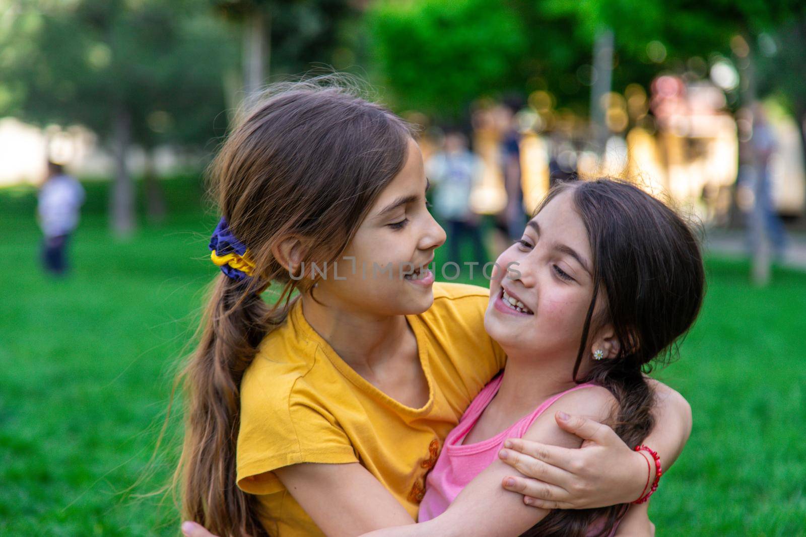 girlfriends children hugging in the park.selective focus. by mila1784