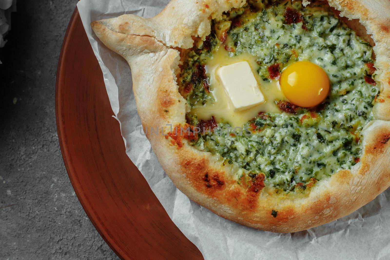 Some khachapuri traditional Georgian homemade cheese and spinach pies on the plate by UcheaD