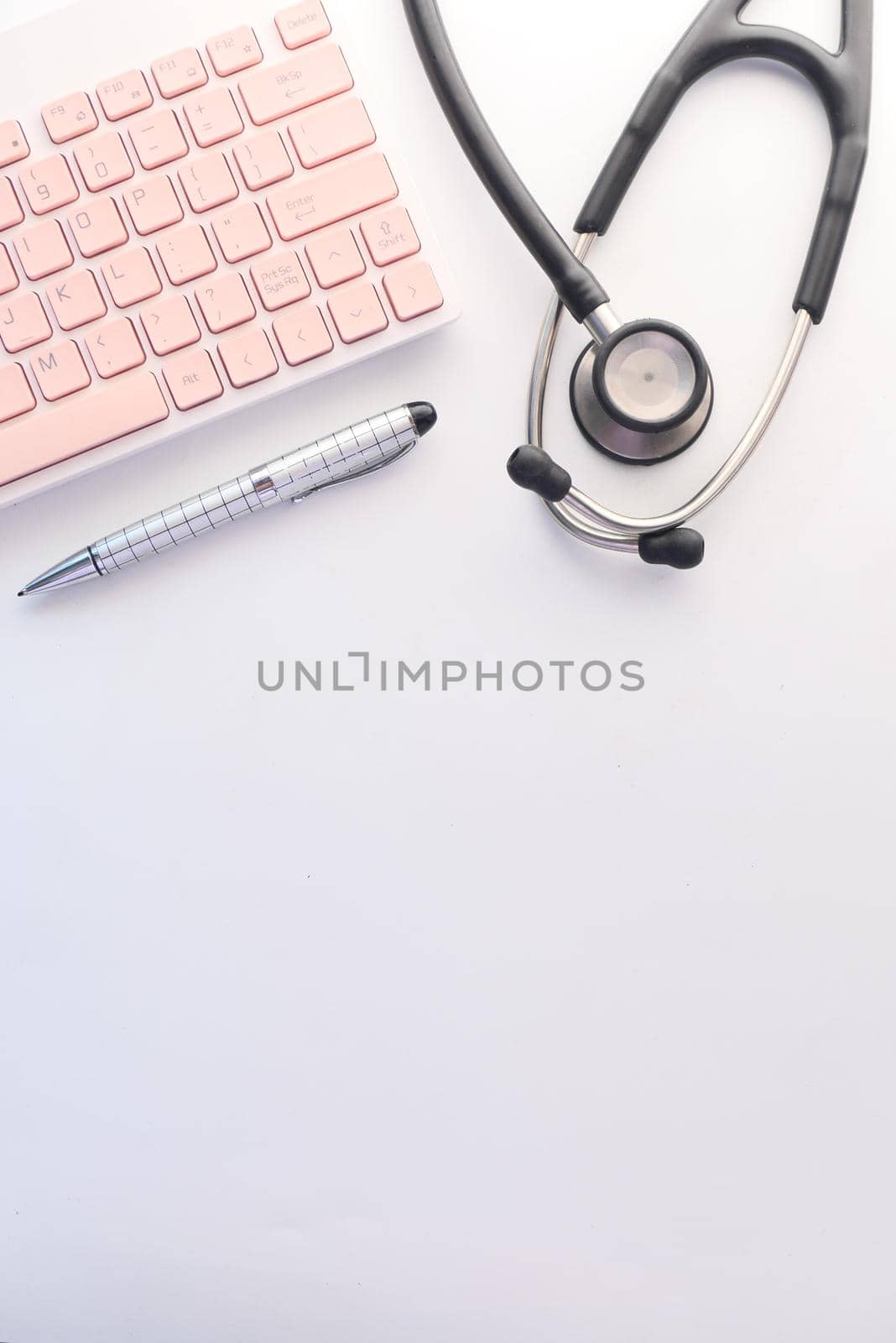 doctors workplace with container, keyboard and prescription on desk