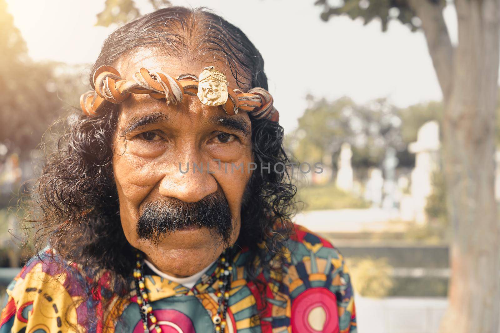 Portrait of an elderly man dressed as Jesus Christ with a leather crown in a cemetery in Managua Nicaragua