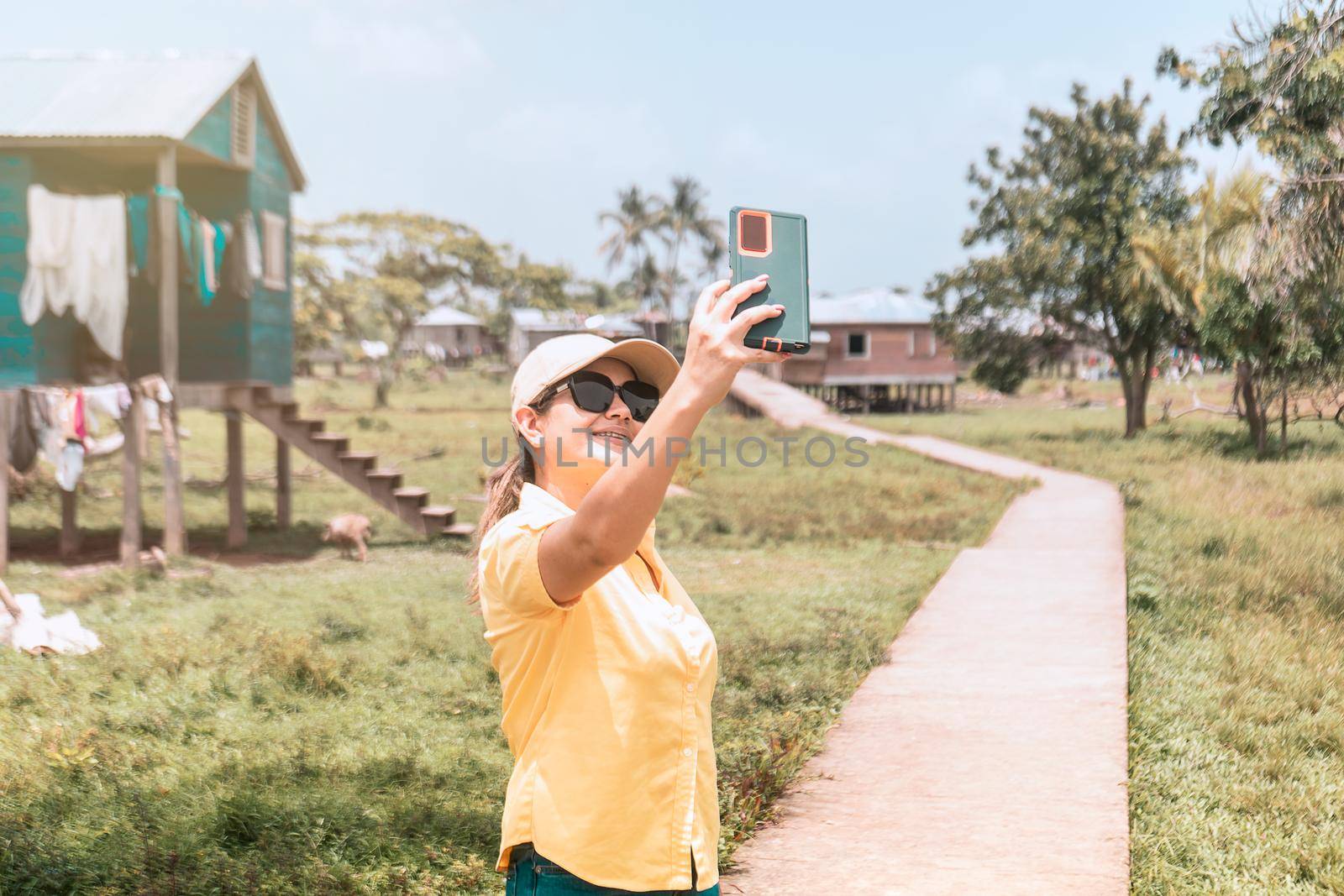 Latin woman taking a selfie in an Afro-descendant indigenous community on the Caribbean coast of Nicaragua