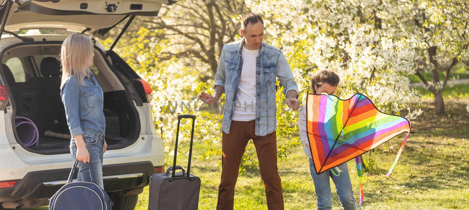 asian muslim family with suitcase prepare to go. concept of family travelling by Andelov13