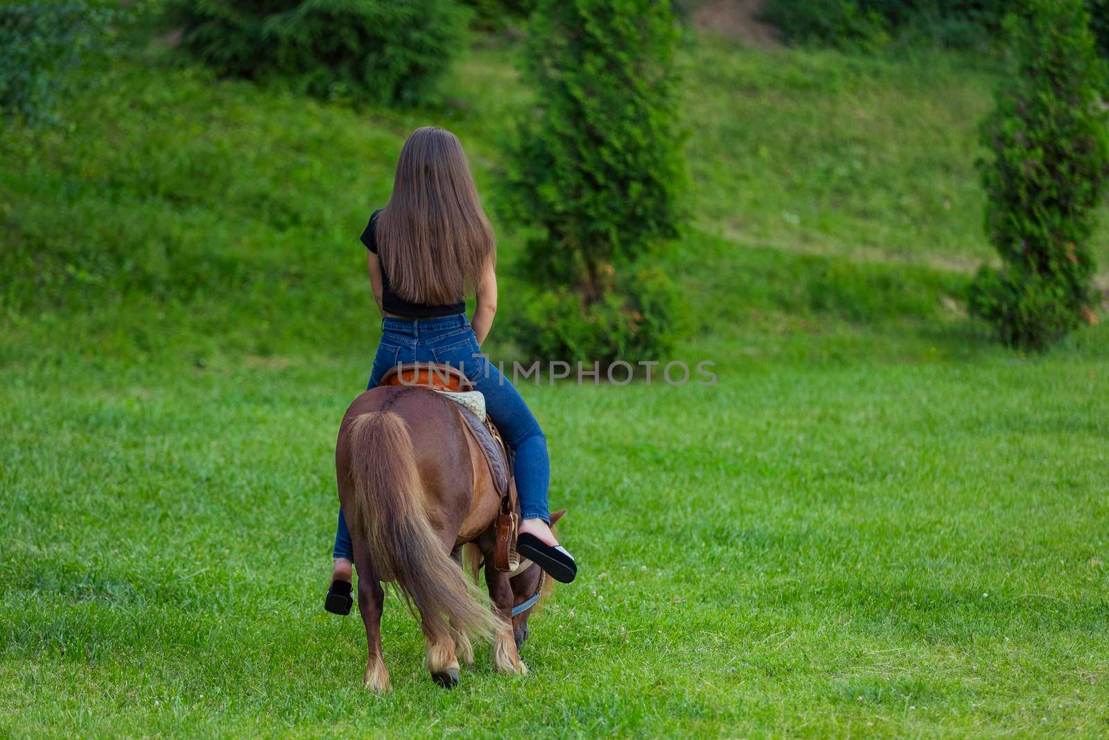 woman riding a pony by zokov