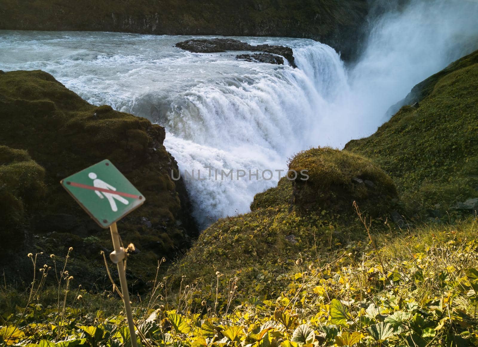 Gullfoss massive waterfall and hiking forbidden sign in Iceland