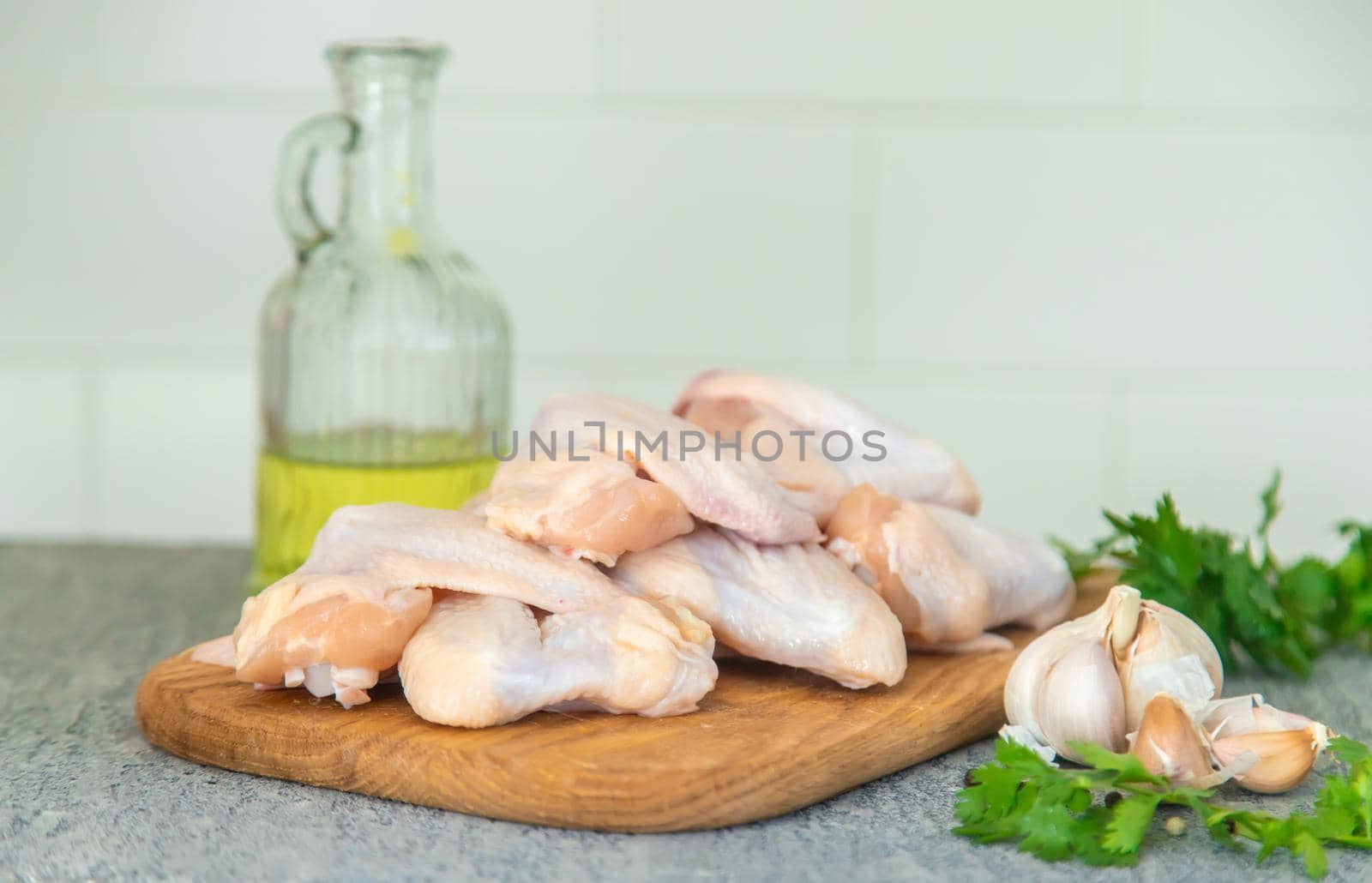 Raw meat chicken wings on a board. Selective focus. Nature.