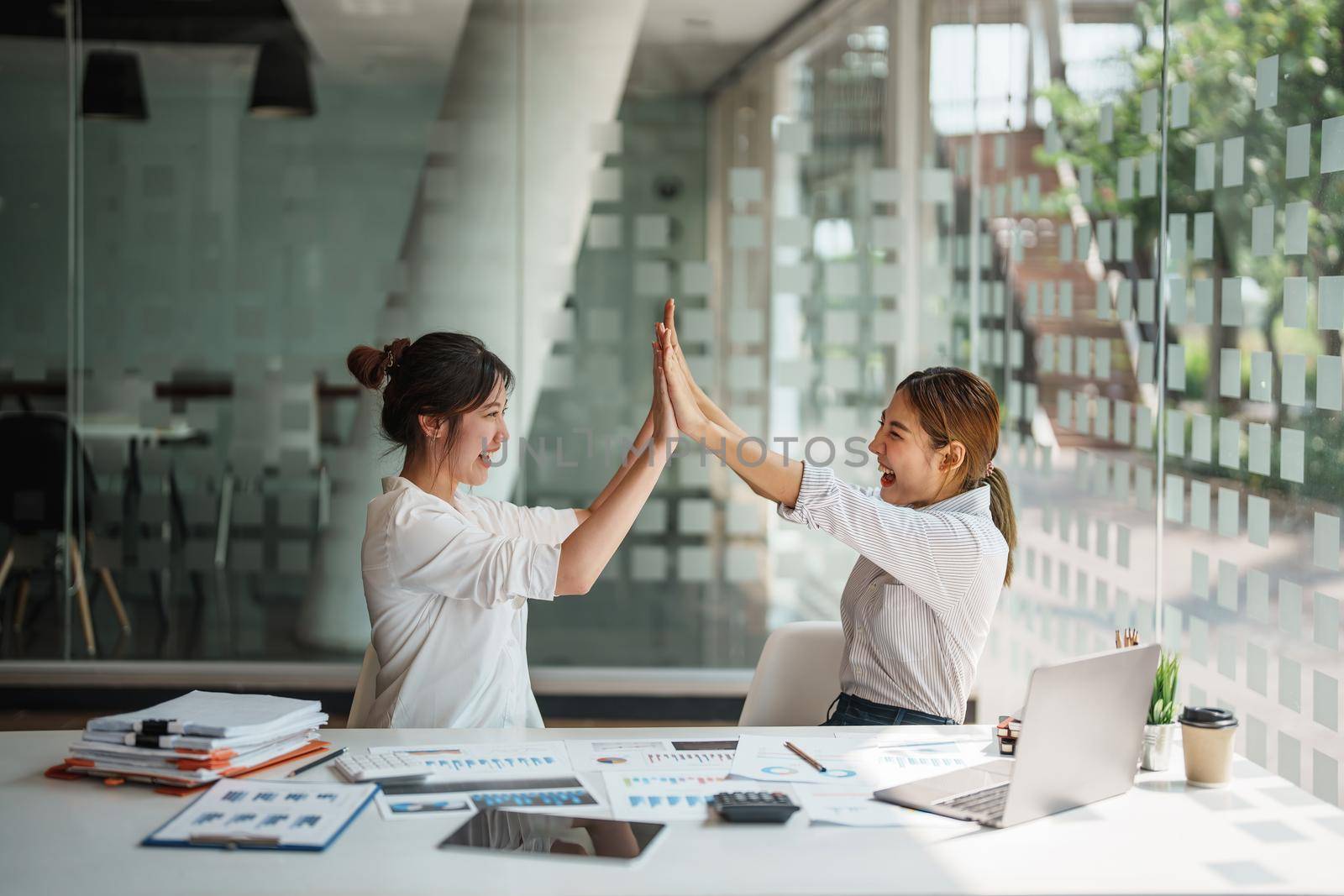 Business Success concept with partner, Partnership Giving Fist Bump after Complete a deal. Successful Teamwork, Businessman with Team Agreement in Corporate. by Manastrong