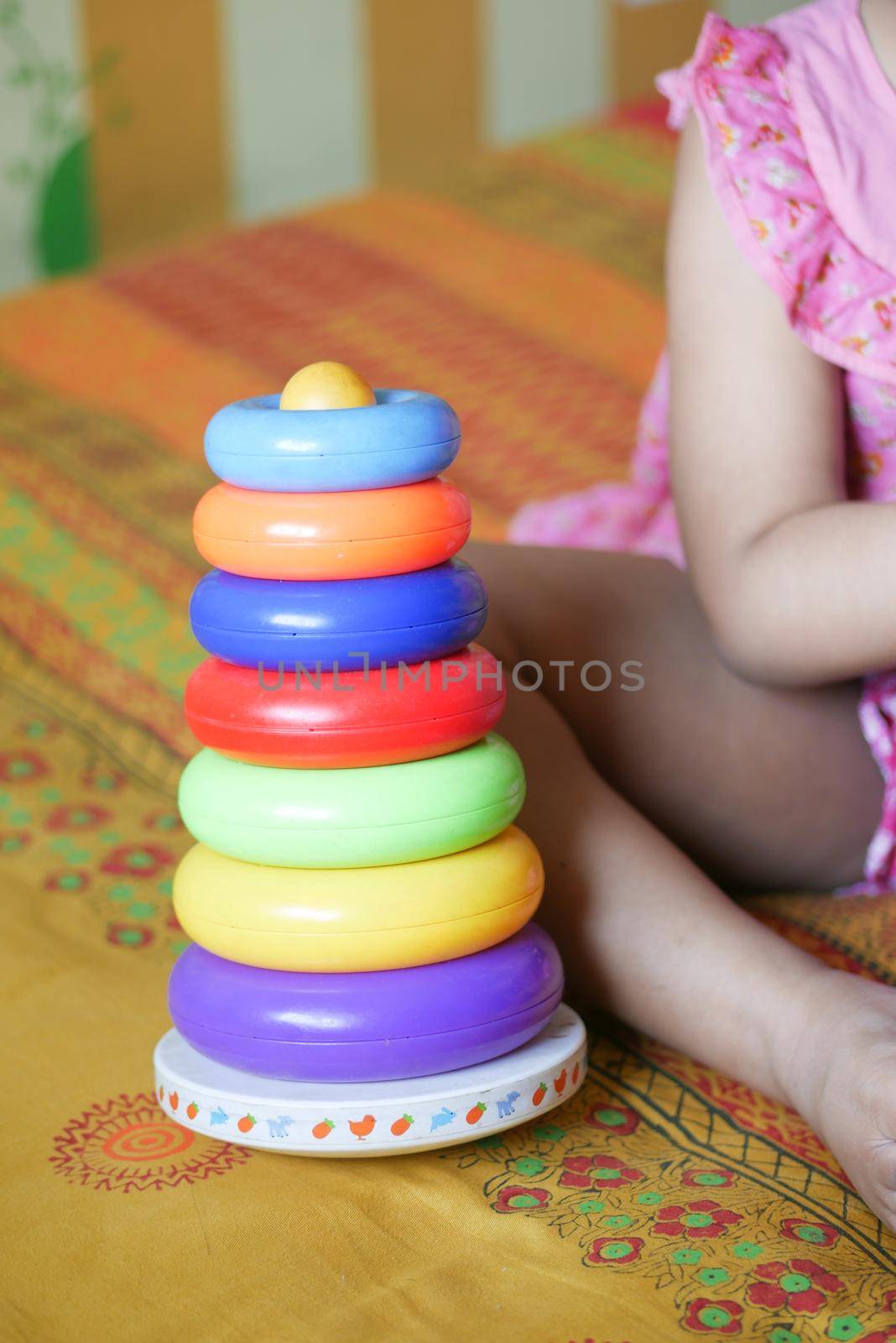 child playing with a Baby toys on bed, Child development concept