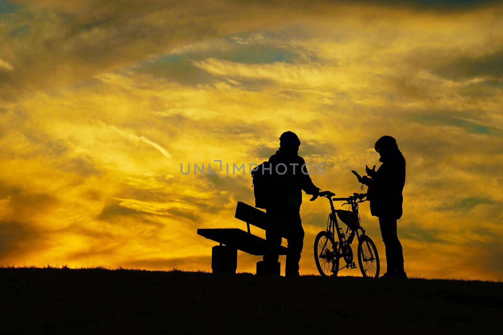 People standing on the hill at dusk. Shooting Location: Mitaka City, Tokyo