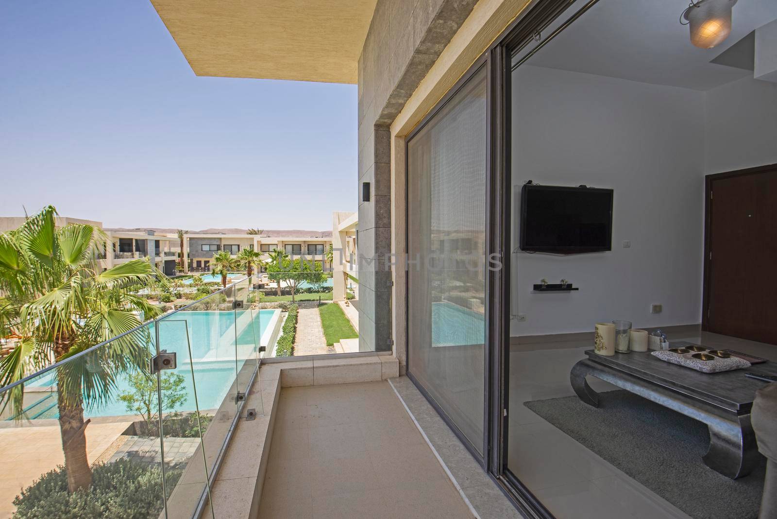 Terrace balcony in tropical luxury apartment resort with pool by paulvinten