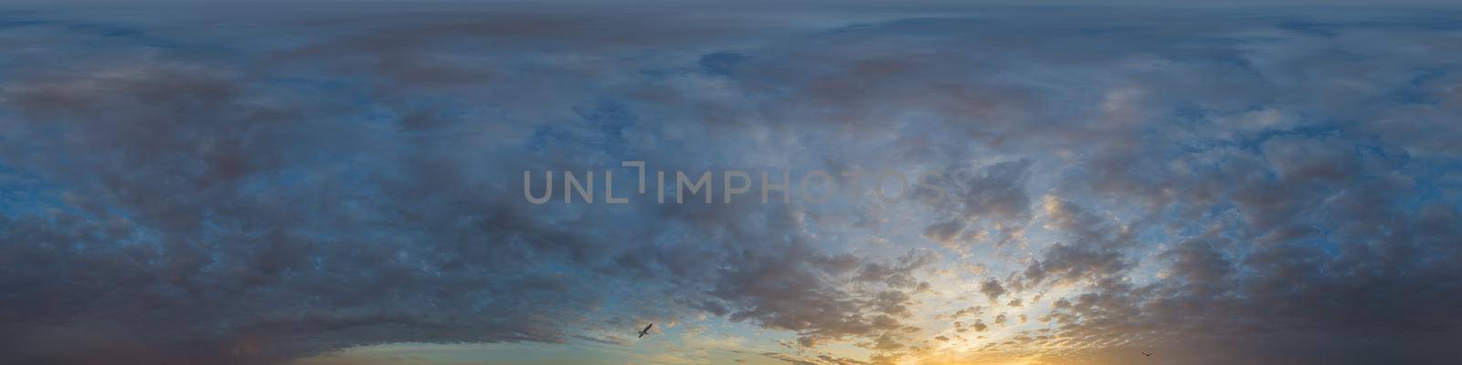 Panorama of a dark blue sunset sky with golden Cumulus clouds. Seamless hdr 360 panorama in spherical equiangular format. Full zenith for 3D visualization, sky replacement for aerial drone panoramas. by Matiunina