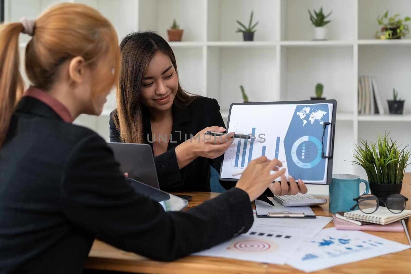 Business People Talking Discussing with coworker planning analyzing financial document data charts and graphs in Meeting and successful teamwork Concept