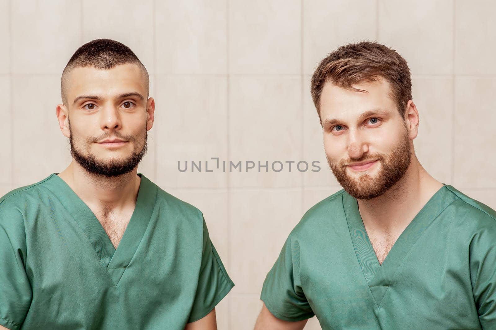 portrait of two male massage therapists. by okskukuruza