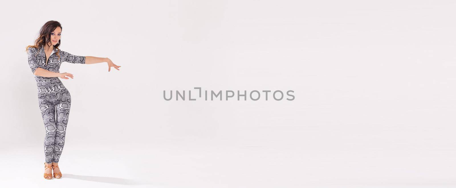 Banner latina dance strip contemporary and bachata lady concept - Woman dancing improvisation and moving her long hair on a white background with copy space by Satura86