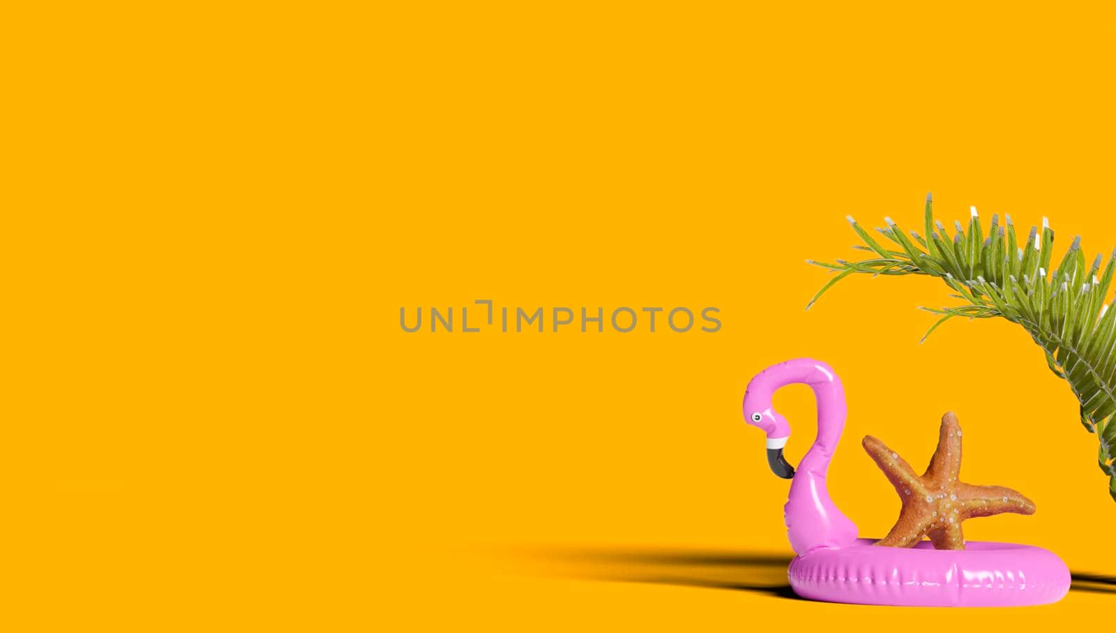 Image of a pink flamingo-shaped float ideal for summer while on vacation at the beach or by the pool. Copy space. 3d rendering. by jbruiz78