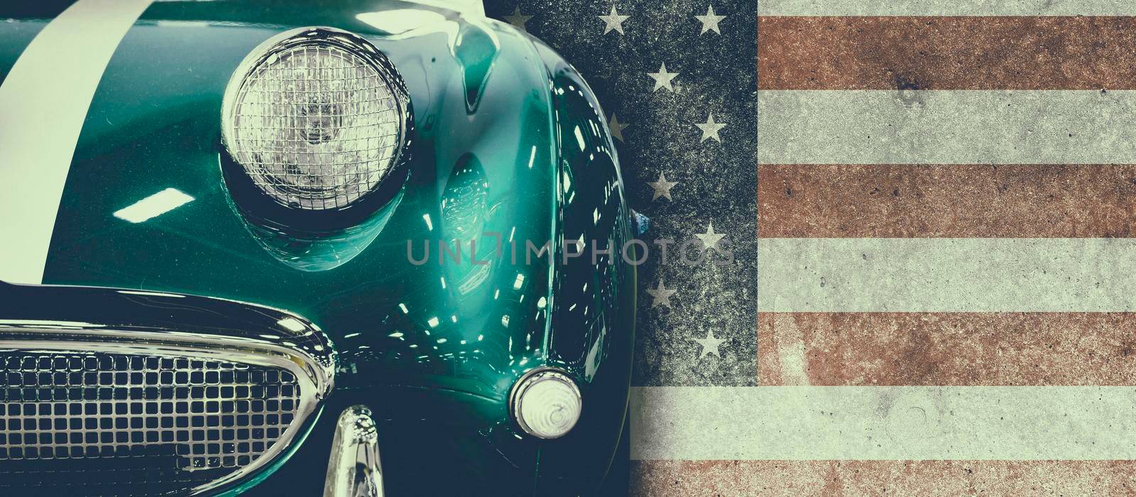 Front view of a vintage car with USA flag in background