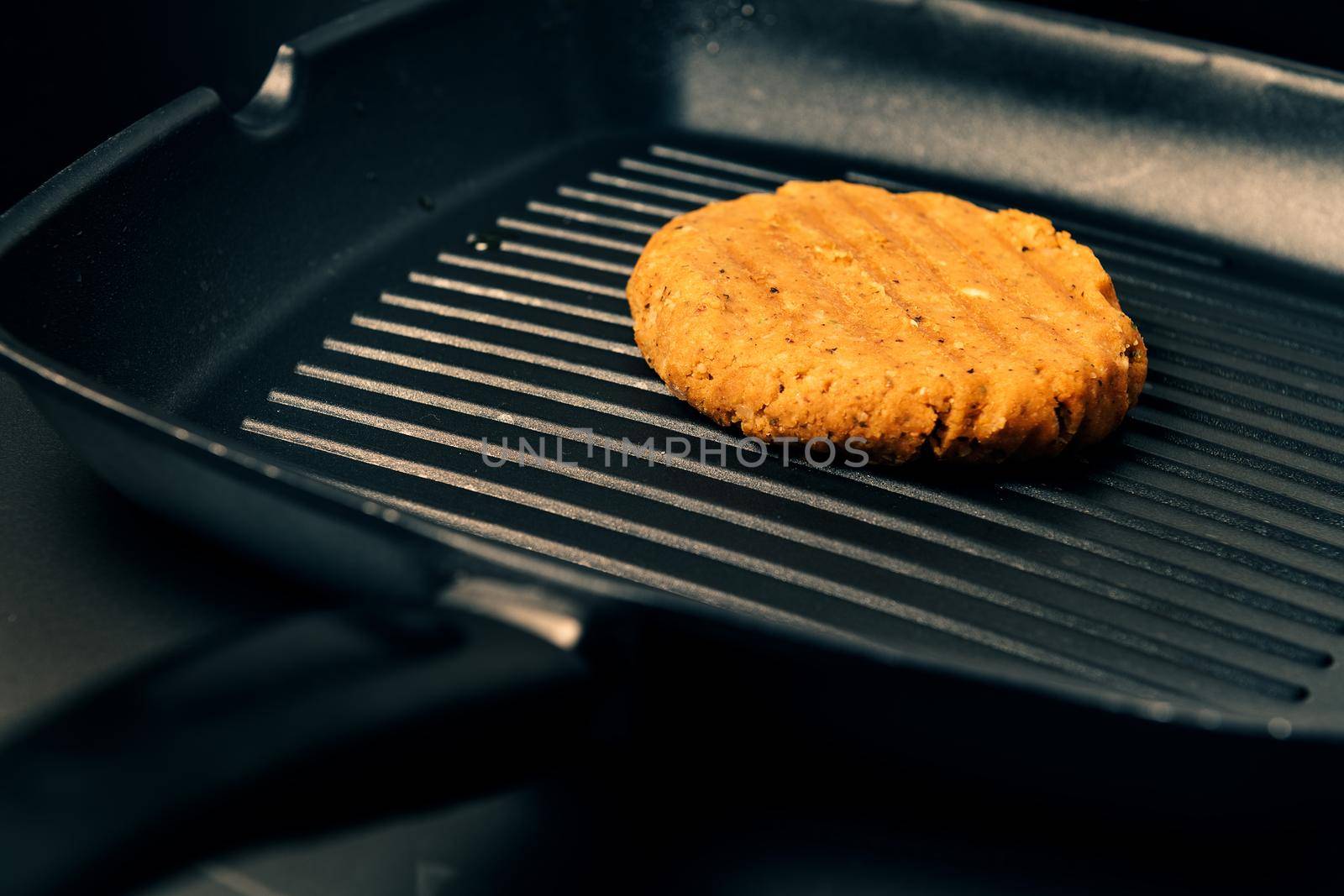 vegan burger cooking on the iron, vegetarian food and healthy lifestyle concept