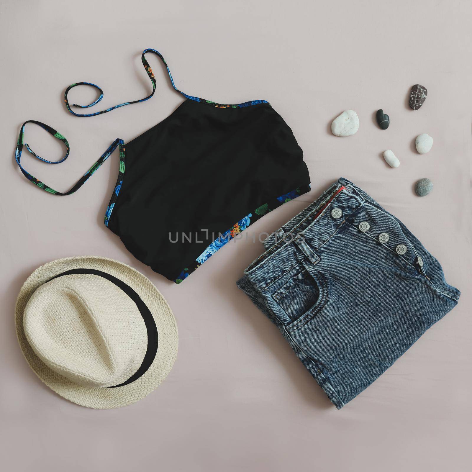 Summer fashion, vacation on sea. Swimwear, denim shorts, straw hat top view, flatlay.