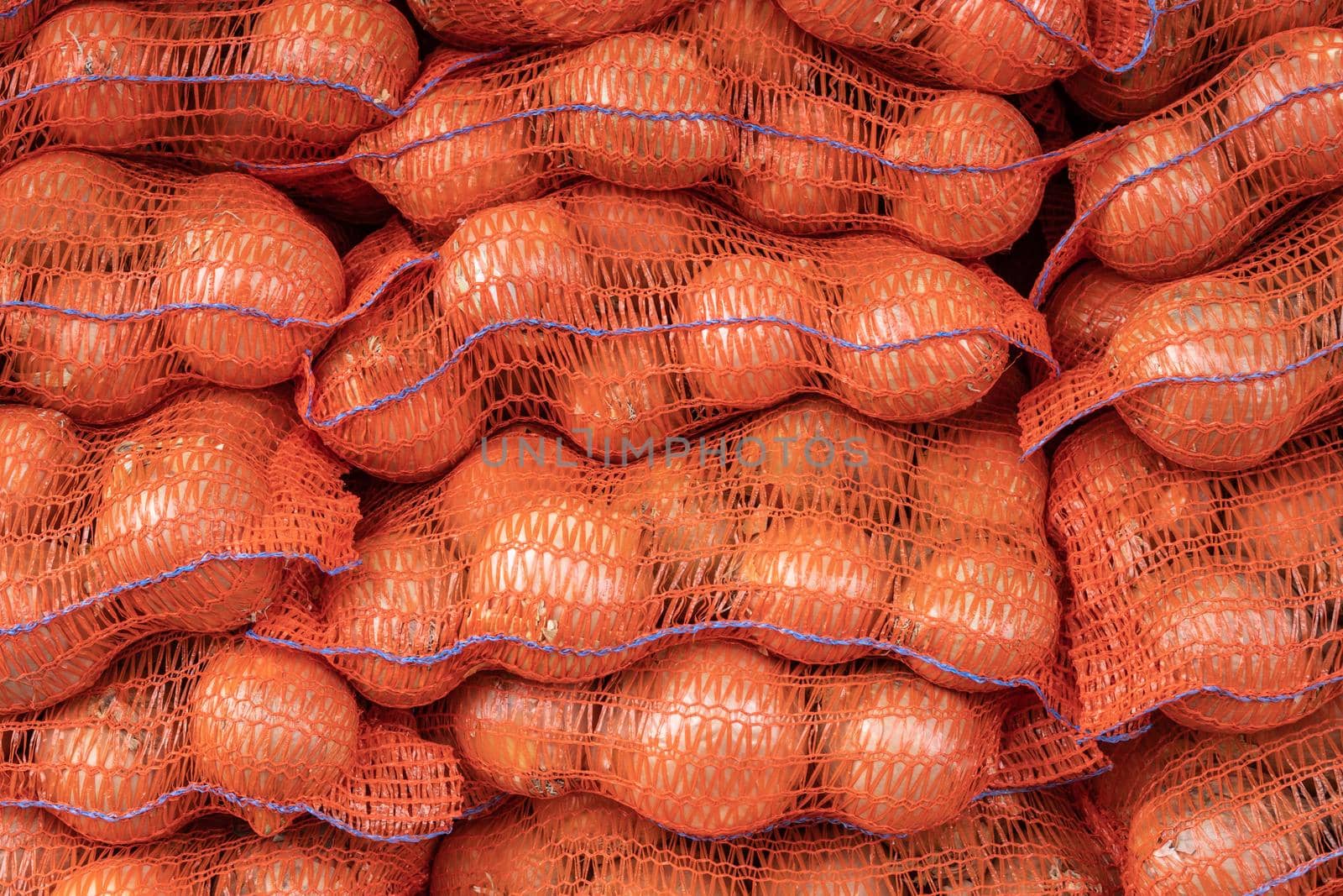 Abstract Background Texture Of Sacks Of Onions At A Market