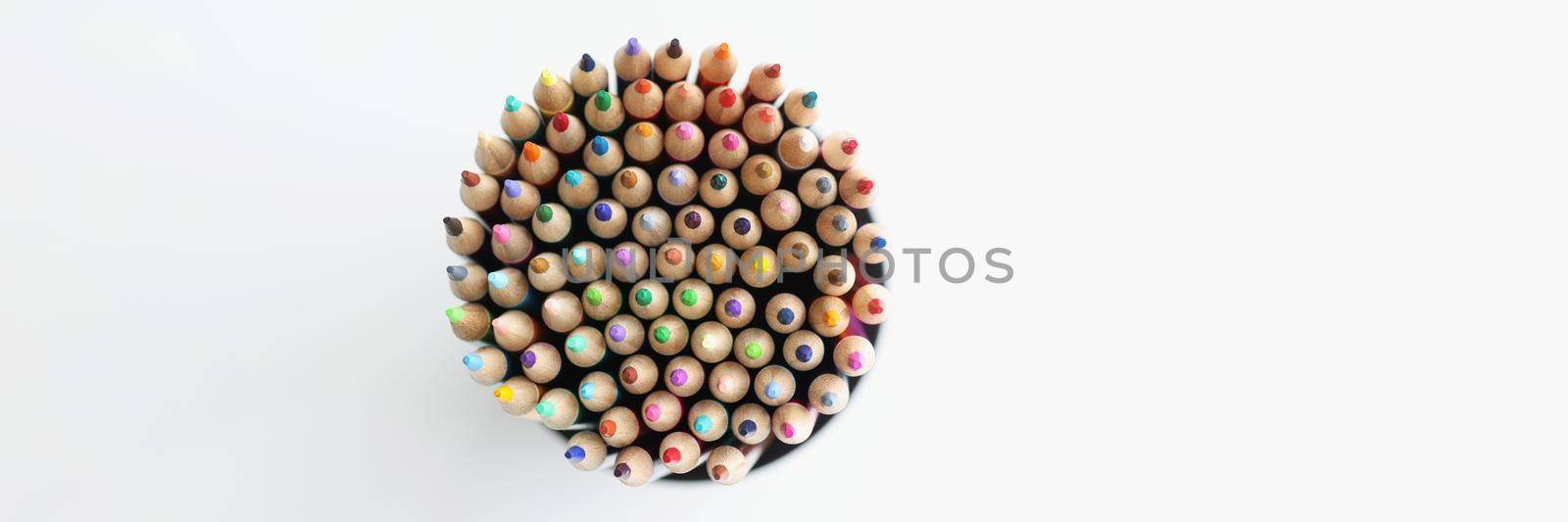 Collection of colourful pencils placed in round shaped container by kuprevich