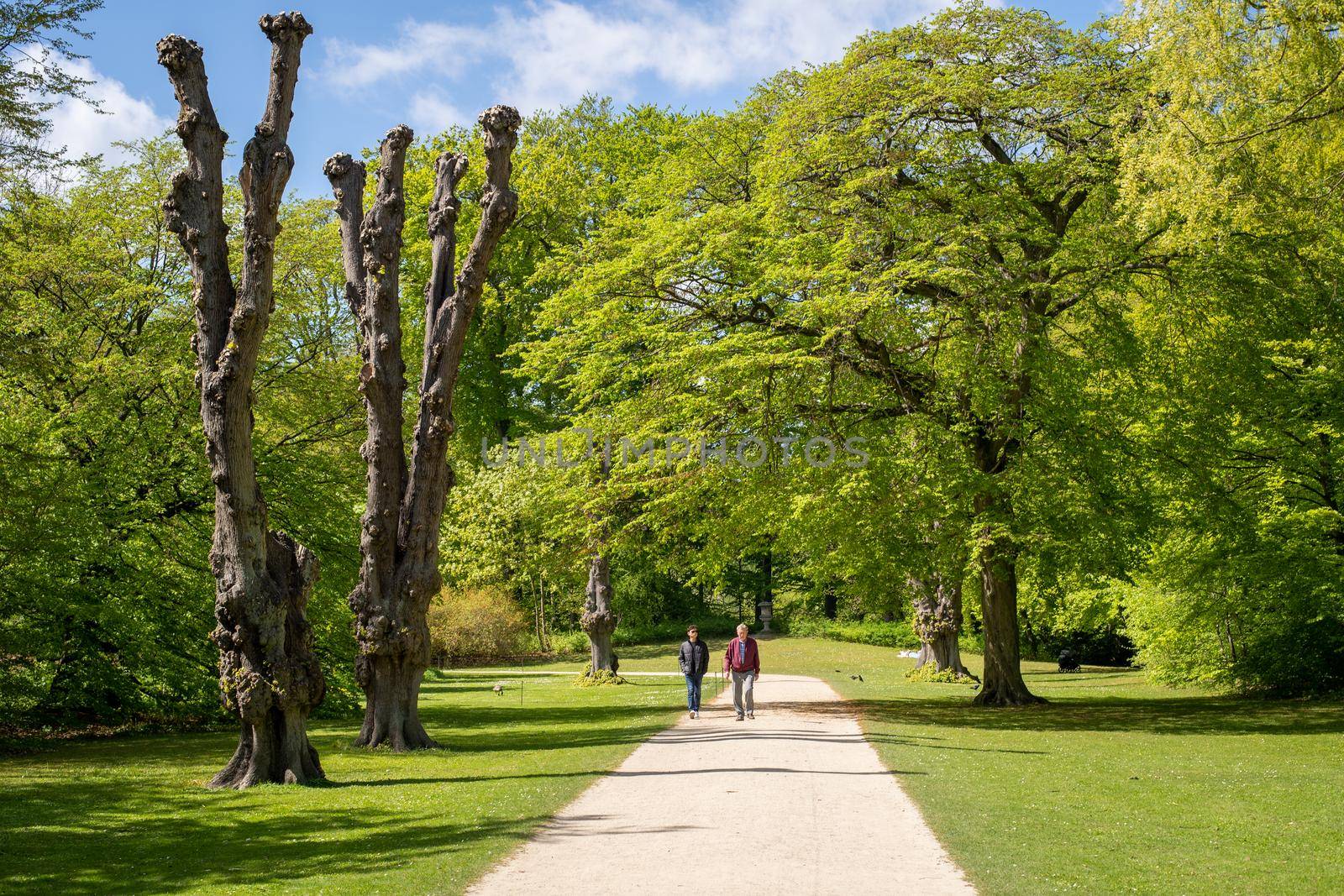 Copenhagen, Denmark - May 07, 2022: People enjoying a sunny day in Frederiksberg Gardens during spring