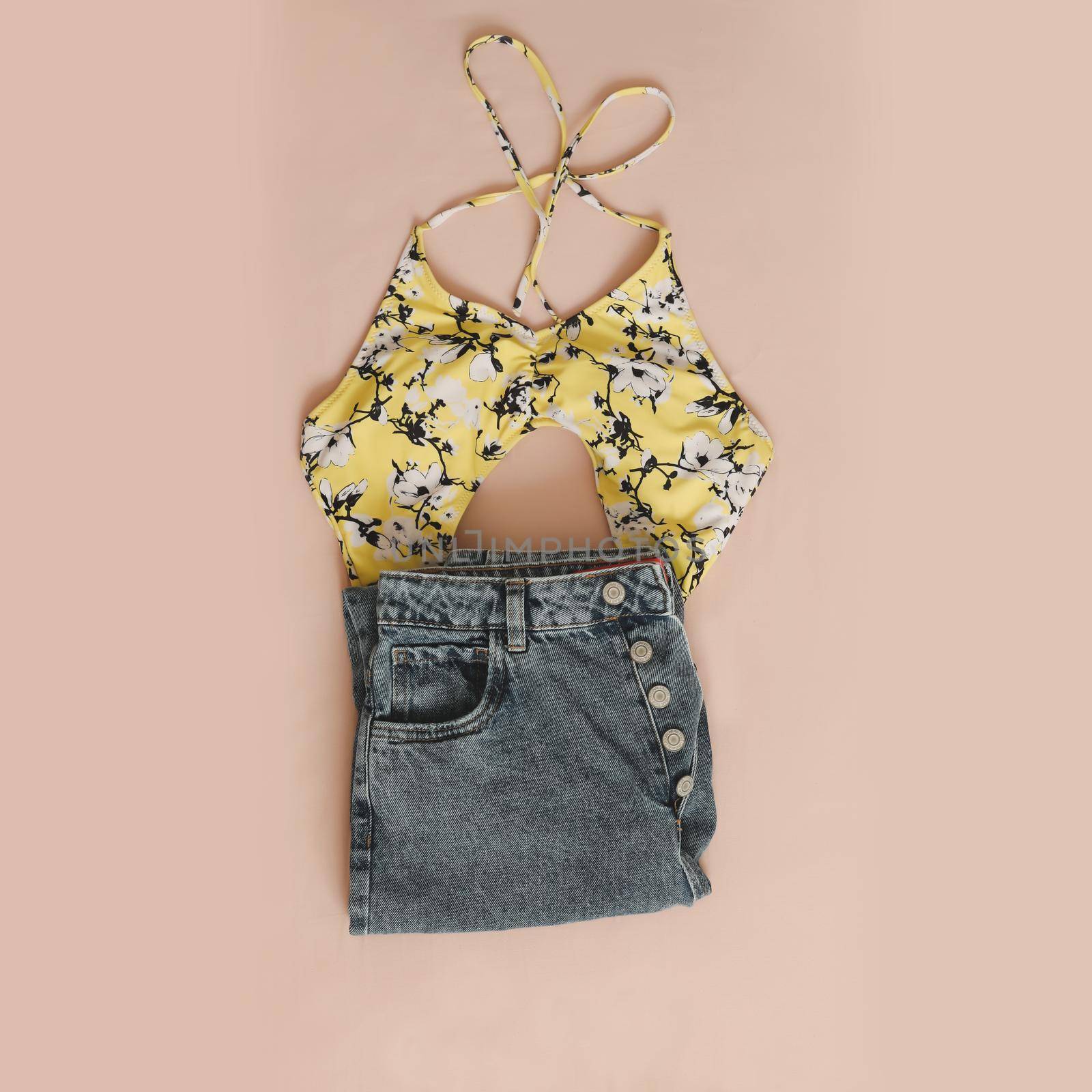 Summer fashion, vacation on sea concept. flat lay composition with swimwear and denim shorts top view