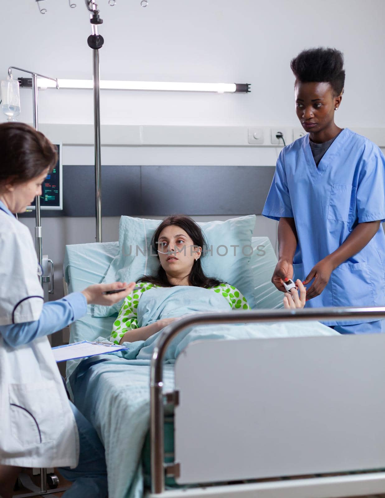 Sick woman resting in bed with nasal oxygen tube by DCStudio