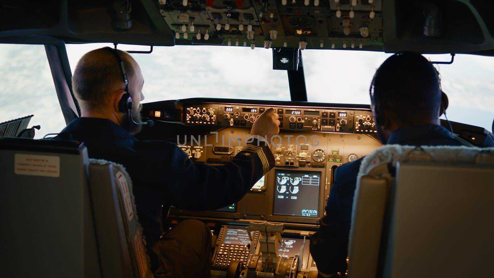 Airplane captain and copilot looking at radar compass on dashboard, flying plane with engine lever and windscreen. Control panel command to takeoff and fly aircraft.