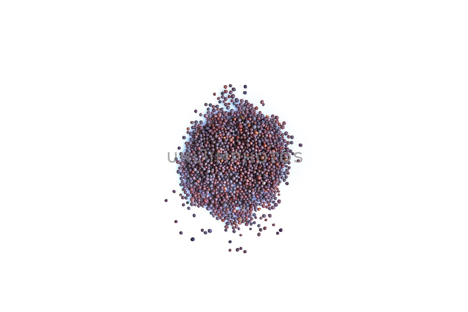 Black mustard seeds spices on white background. Close-up