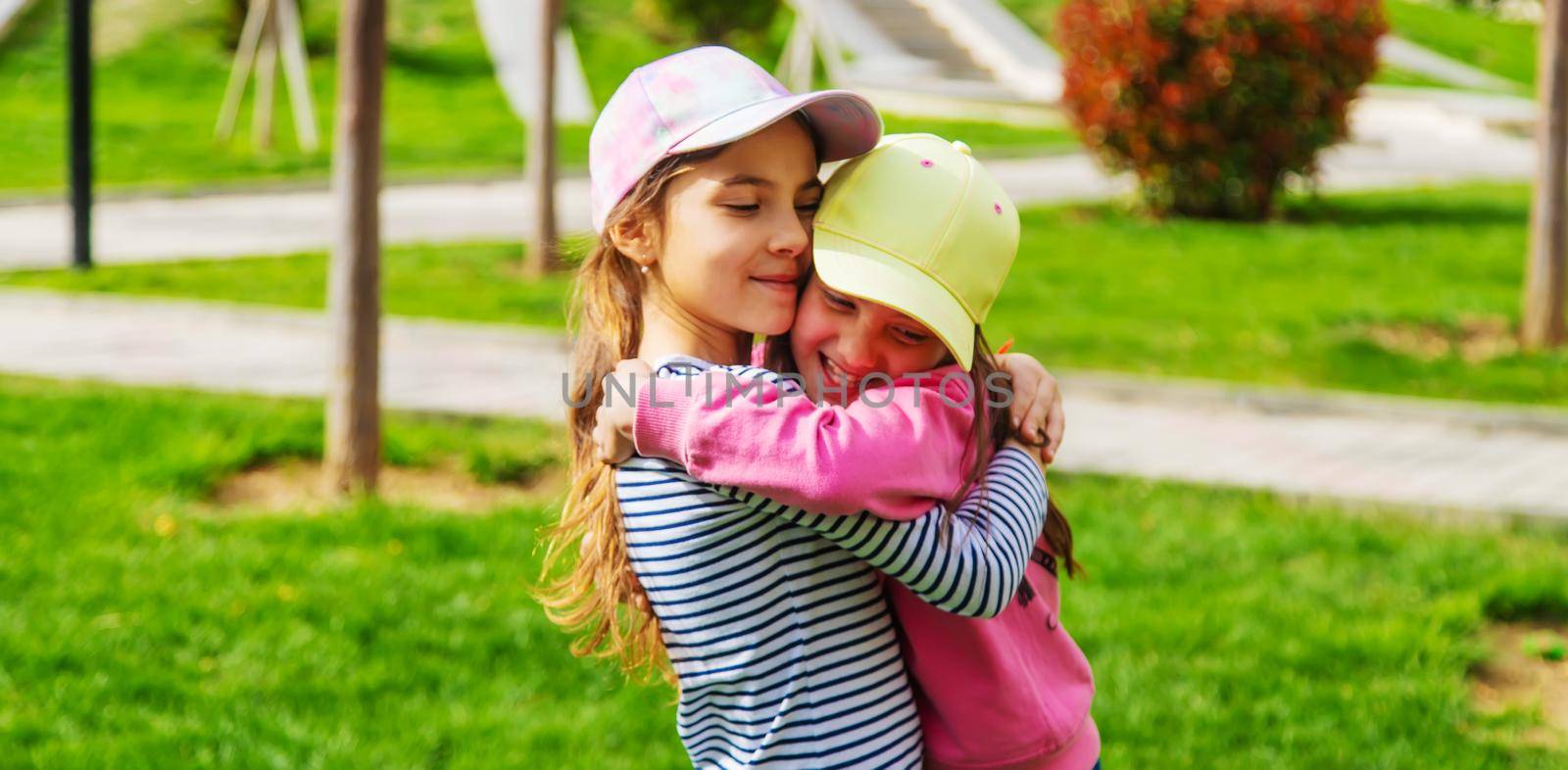 girlfriends children hugging in the park.selective focus.kids