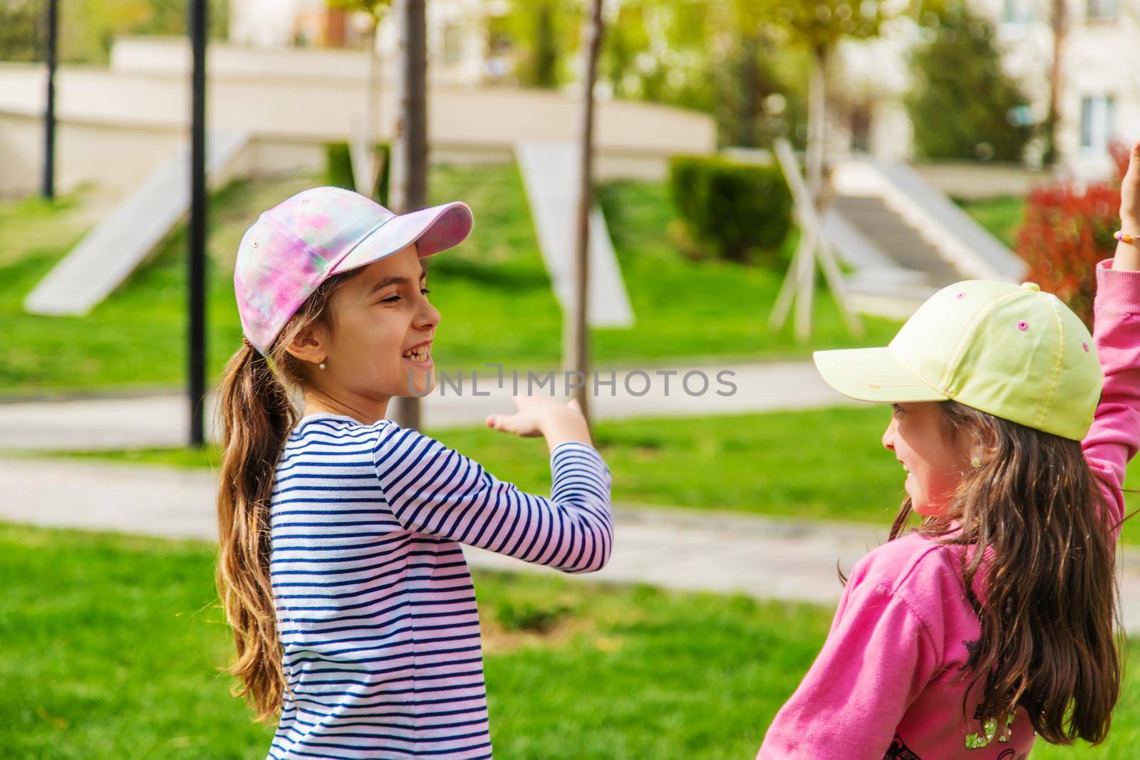 girlfriends children hugging in the park.selective focus by mila1784