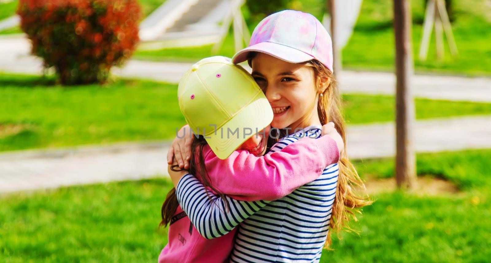 girlfriends children hugging in the park.selective focus.kids